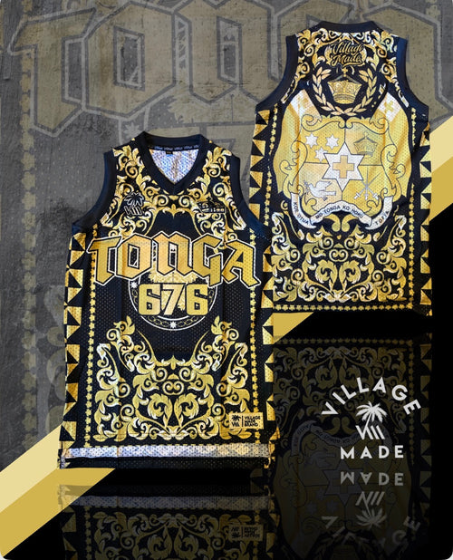 Tonga 676 basketball jersey front and back displayed side by side, featuring a black and gold versace pattern. The jerseys are set against a textured gray background with a yellow diagonal accent and a 'Village Made' logo overlay.